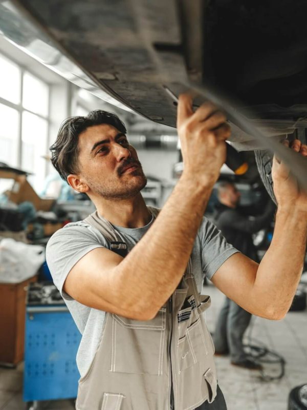 workman-mechanic-working-under-car-in-auto-repair-shop.jpg